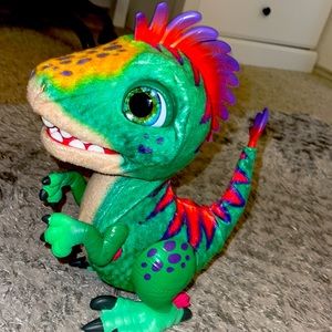 Selling a kids toy dinosaur the color green and gold and red